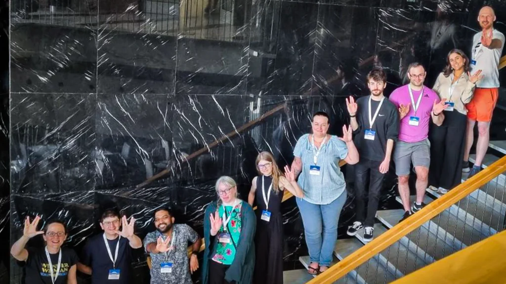 A picture of several ELIXIR-UK members at the 2024 Galaxy Community Meeting. Wendi Bacon, on the bottom left; Julia Jakiela, fifth from the left; and Morgan Howels, fourth from the right.